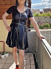 A lovely ladyboy is posing naked inside with a great body